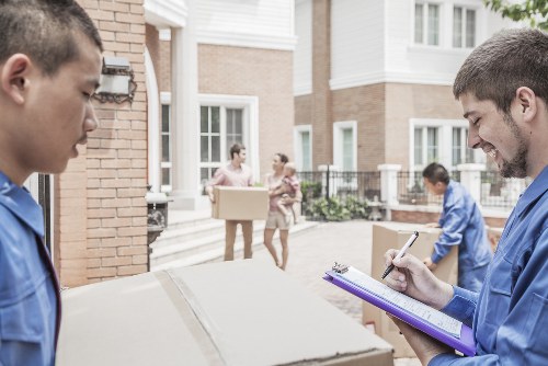 Removalists loading household furniture in Highbury