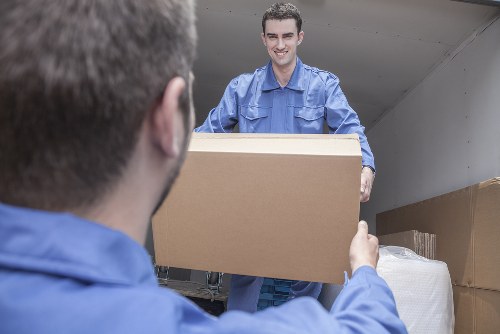 Man and van loading furniture in a Highbury residential street