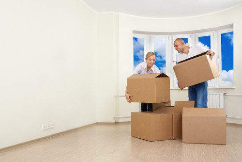 Loading office furniture from a commercial property in Highbury into a removals vehicle