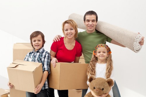 Careful loading of student belongings into a removals van