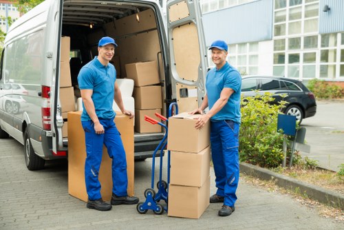 Packing fragile household items with protective materials in Highbury