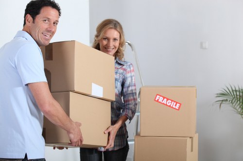 House moving team handling boxes and furniture in Highbury